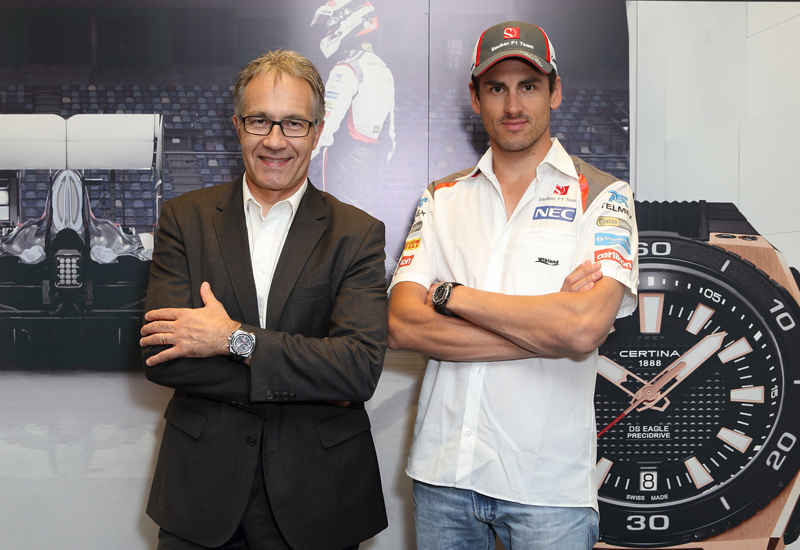 Certina president adrian bosshard with f1 driver adrian sutil